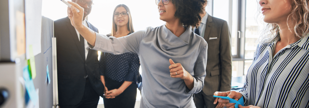 Diverse professionals, working together, centered on black female executive